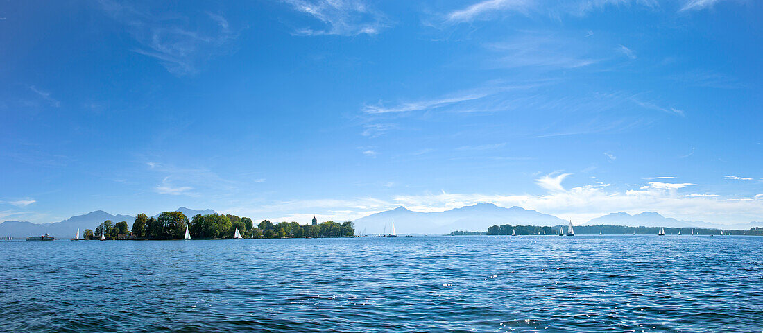 Panoramic view with Fraueninsel with Kampenwand  and Hochgern in the background, Chiemsee, Chiemgau, Upper Bavaria, Bavaria, Germany