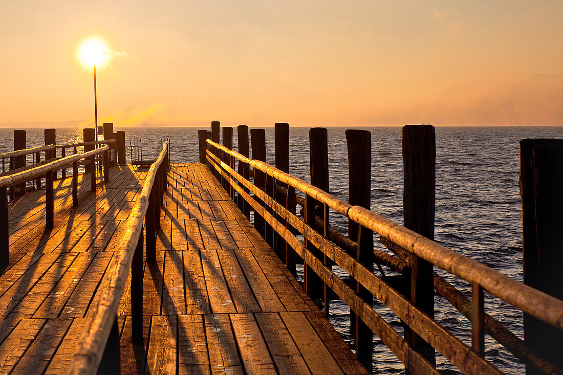 Wooden jetty in the morning light, Fraueninsel, Chiemsee, Chiemgau, Upper Bavaria, Bavaria, Germany