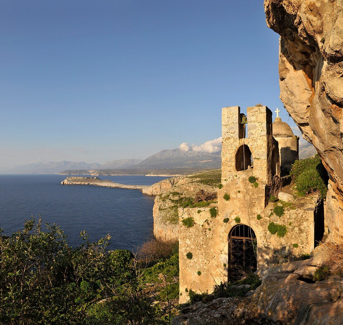 The 13th century Byzantine church of Odigitraea, known localy asAgitria,  set in a dramatic location In The Deep Mani, near Stavri, in the middle distance is the Tigani peninsula, with the Taygetos mountains in the background Southern Peloponnese, Greec
