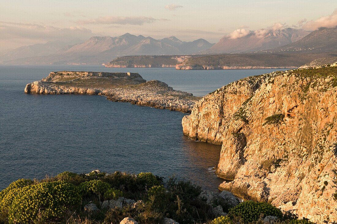 The Tigani peninsula, in the Deep Mani, with the Taygetos mountains in the background Southern Peloponnese, Greece The peninsular is also known as Grand Maina, and is associated with the site of Guillaume de Villehardouin's castle of that name