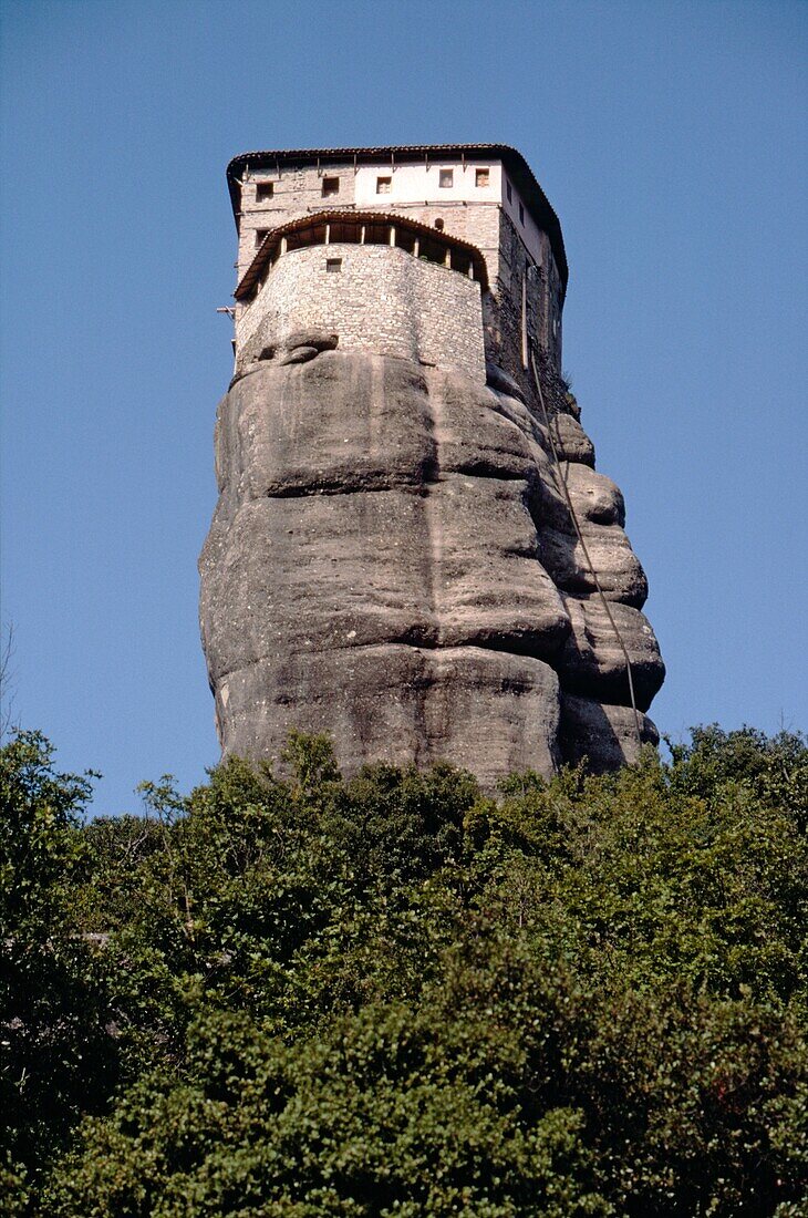 Looking up at the monastery of Roussanou atop its strange rock formation, one of many in the Meteora, near Kalambaka, Thessaly, central Greece