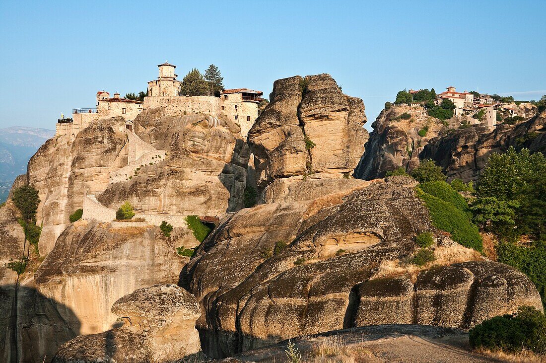 Looking up at the monasteries of Varlaam left and the Great Meteora right, at Meteora, Kalambaka, Thessaly, central Greece