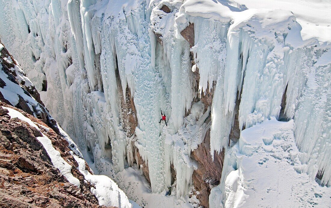 Mark Weber ice climbing a route called Root Canal which is rated WI5 at The Ouary Ice Park in the Uncompahgre River Gorge near the town of Ouray in southwestern Colorado USA