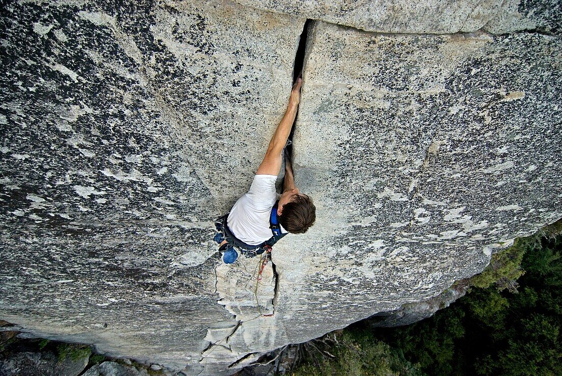 Brian Adam rock climbing a route called Bishop's Terrace which is rated 5, 8 and located at Church Bowl in Yosemite Valley at Yosemite National Park in California USA