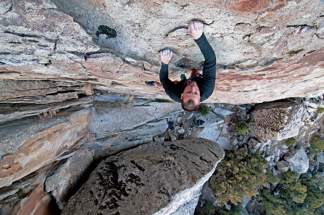 Greg Moore rock climbing a route named Shop And Compare which is rated 5, 10 and located on the Competition Wall at Castle Rocks State Park near the city of Almo in southern Idaho