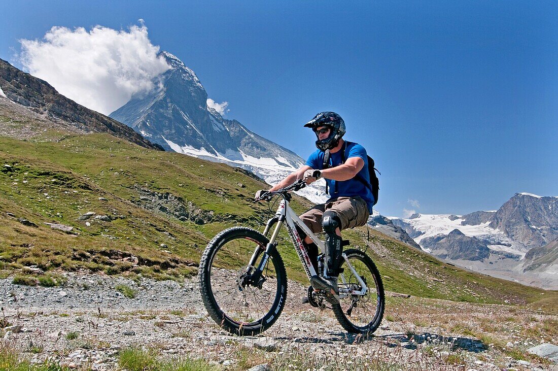 Elijah Weber mountain biking the Matterhorn Trail below Schwarzsee Paradise in the Swiss Alps high above the town of Zermatt Switzerland