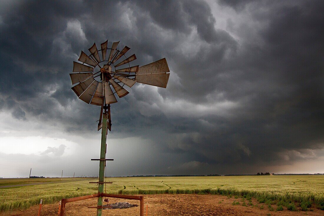 An old-fashioned windmill set against the roiling clouds of a severe thunderstorm in northern Oklahoma, May 12, 2010