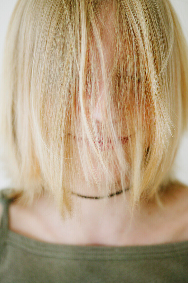 Girl (12 years) with hair covering face