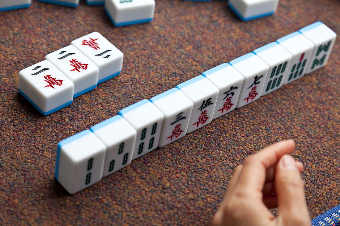 Women playing Majiang, Mahjong, Chinese board game, on the street, Chongqing, People's Republic of China