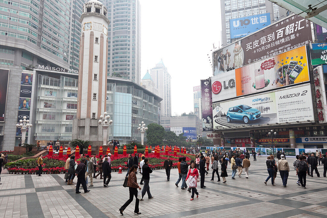 Public square in Chongqing, pedestrians, advertisment and skyscrapers, Chongqing, People's Republic of China