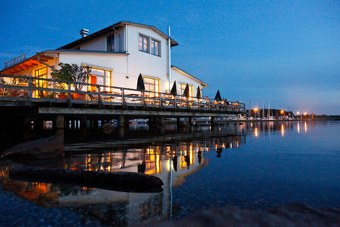 Terrace of a restaurant at Cospuden lake in the evening, Leipzig, Saxony, Germany