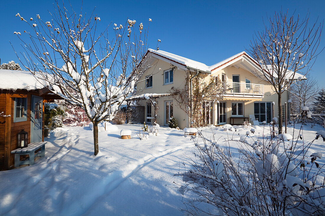 Detached family house with garden in winter, Upper Bavaria, Bavaria, Germany, Europe