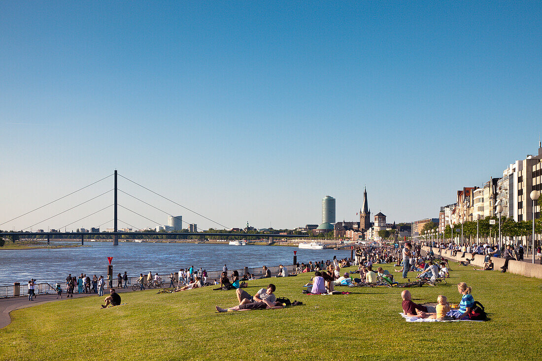 View at people in the Rhine meadows and old town, Düsseldorf, Duesseldorf, North Rhine-Westphalia, Germany, Europe