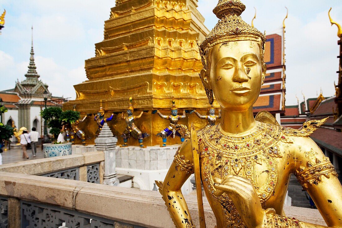 Golden statue within the gates of the Grand Place in Bangkok Thailand