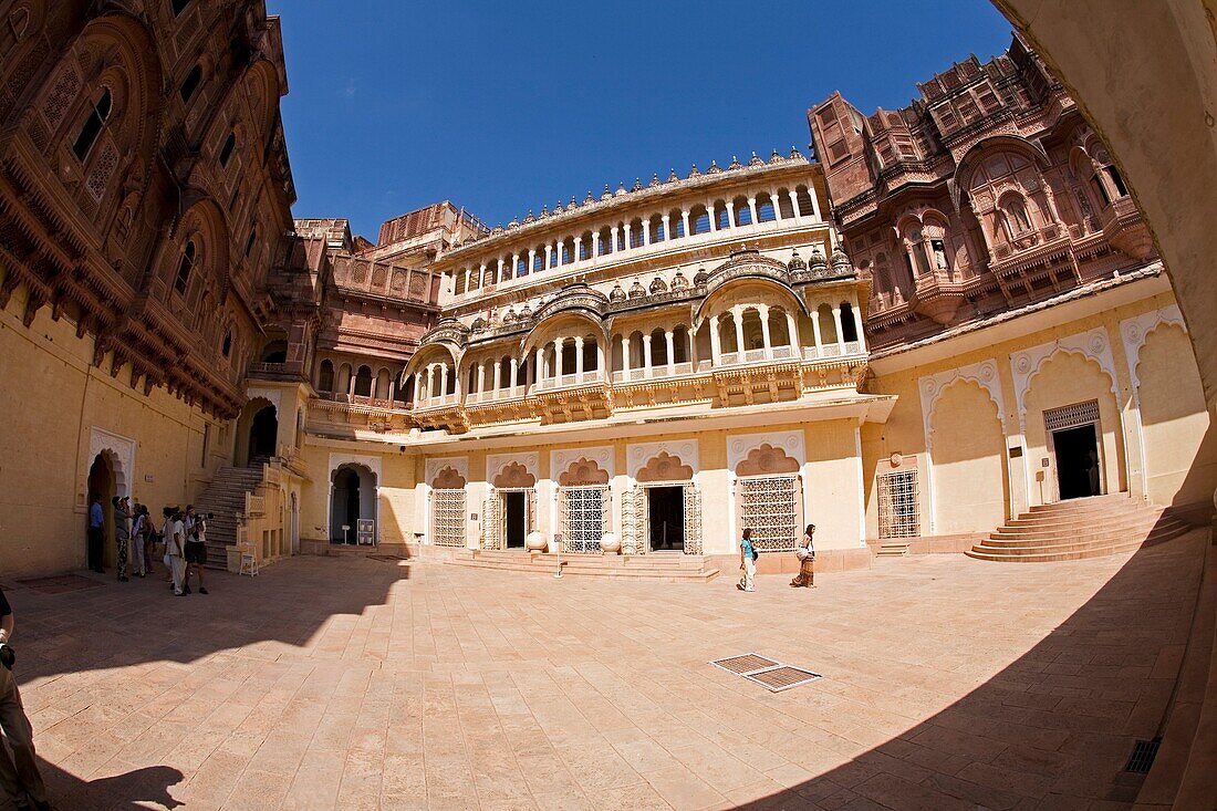 Tourist in one of the courtyards at Fort Mehrangarhin Rajasthan India