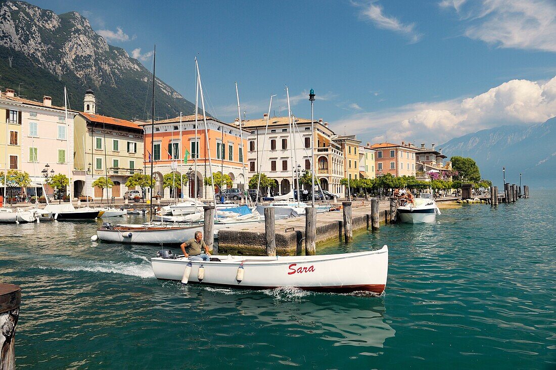 The holiday resort town of Gargnano on Lake Garda, Lombardy, Italy Boat leaving the harbour Lago di Garda