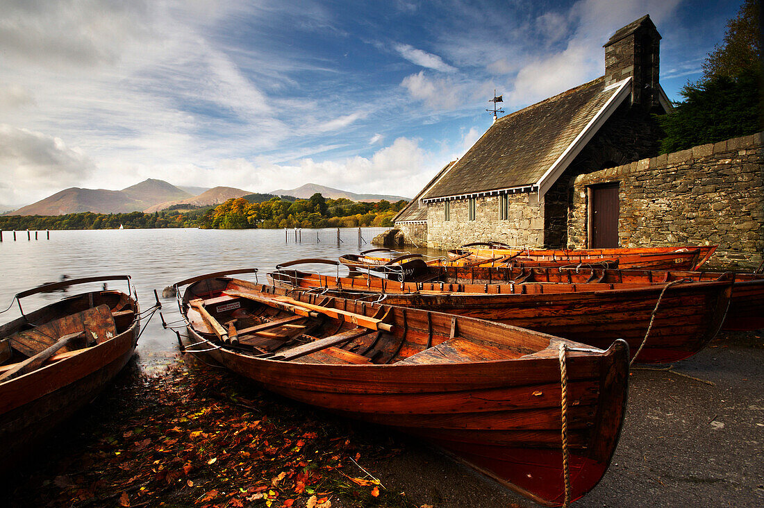 Derwent Water with boats on shore, Lake District National Park, Cumbria, UK - England