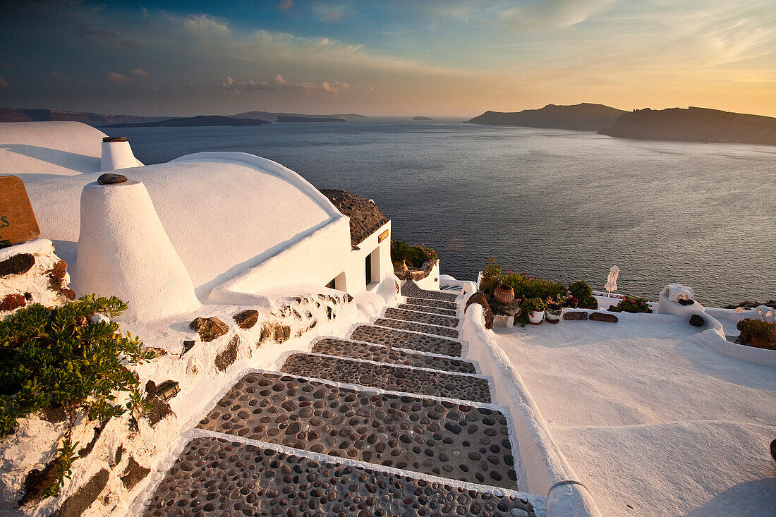 View of sea at sunset from steps, Oia, Santorini Island, Greek Islands