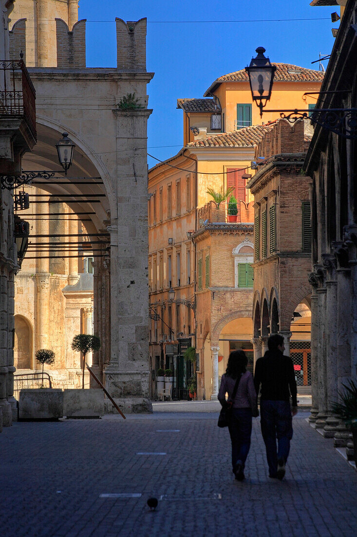 Couple walking in Corso Manzini, Ascoli Piceno, Marche, Italy