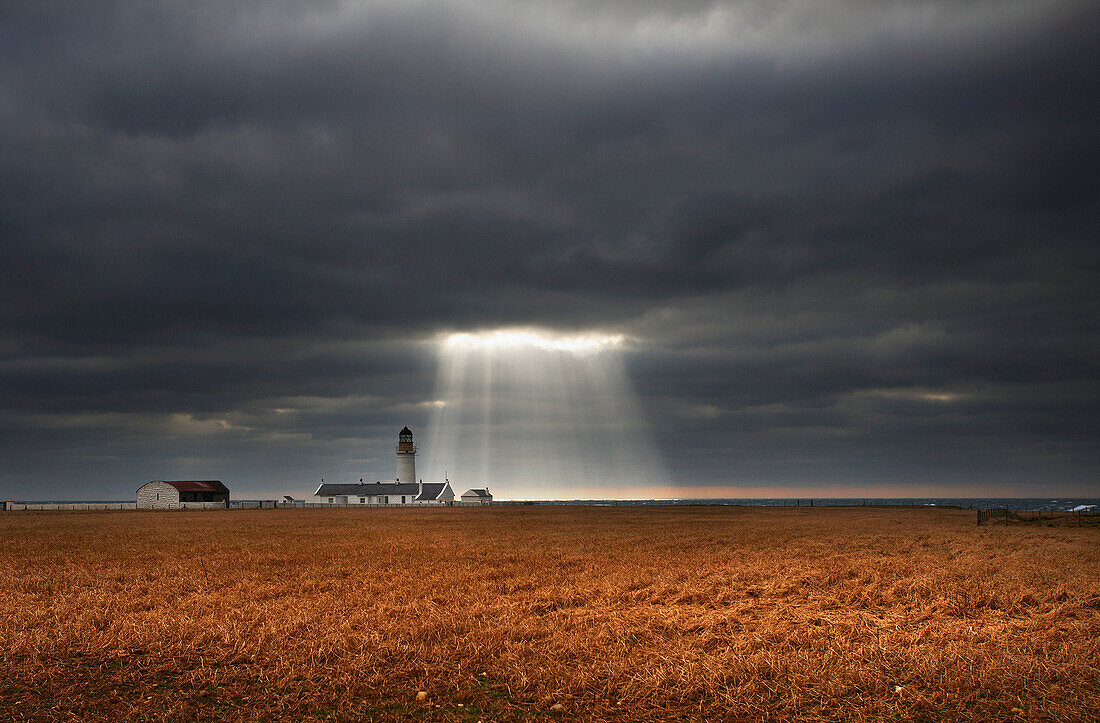 Lighthouse under stormy sky, Langness, Isle Of Man, UK - England