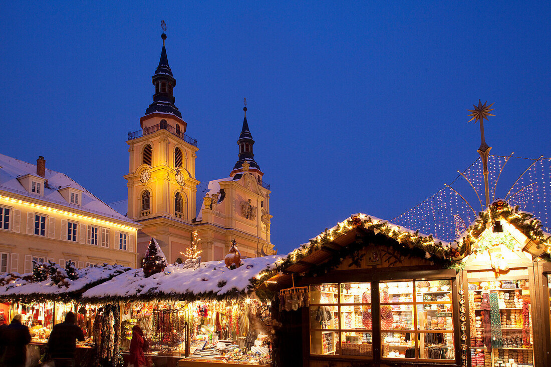 Christmas Market and church at dusk, Ludwigsburg, Baden Wurttemberg, Germany