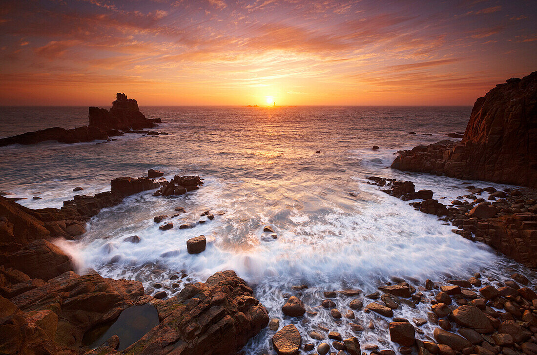 Rugged beach and seascape at sunset, Lands End, Cornwall, UK - England