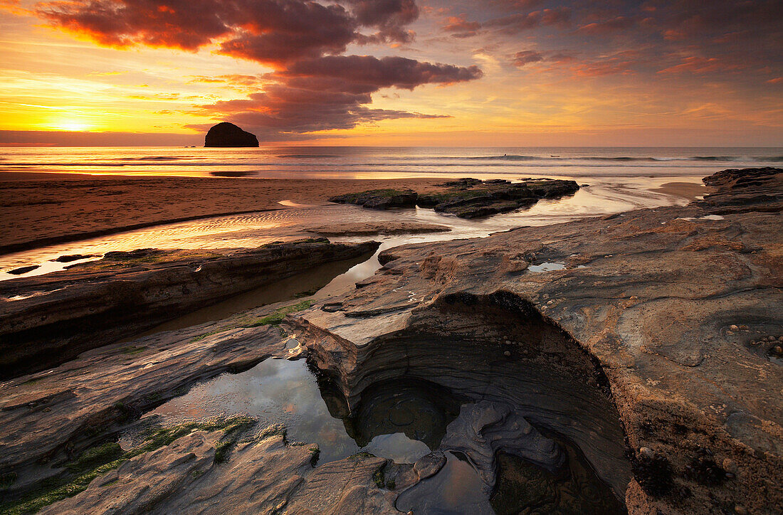 Rocky beach at sunset, Trebarwith Strand, Cornwall, UK - England