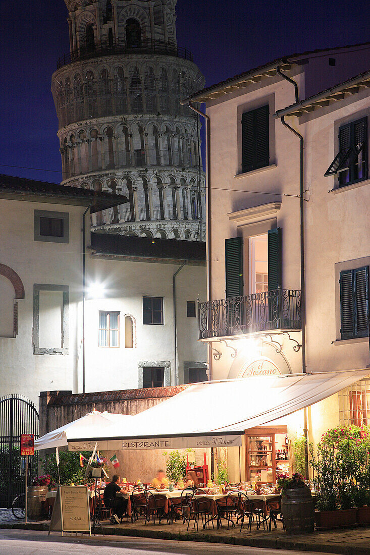 Restaurant and Leaning Tower at night, Pisa, Tuscany, Italy