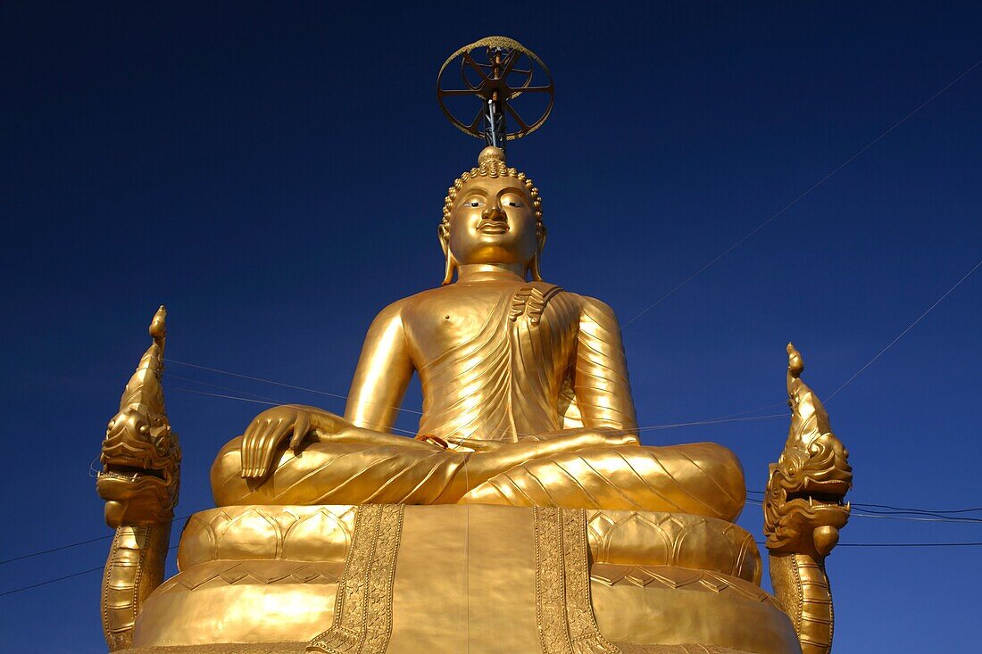 The seated brass Buddha in Subduing Mara, Phuket, Thailand