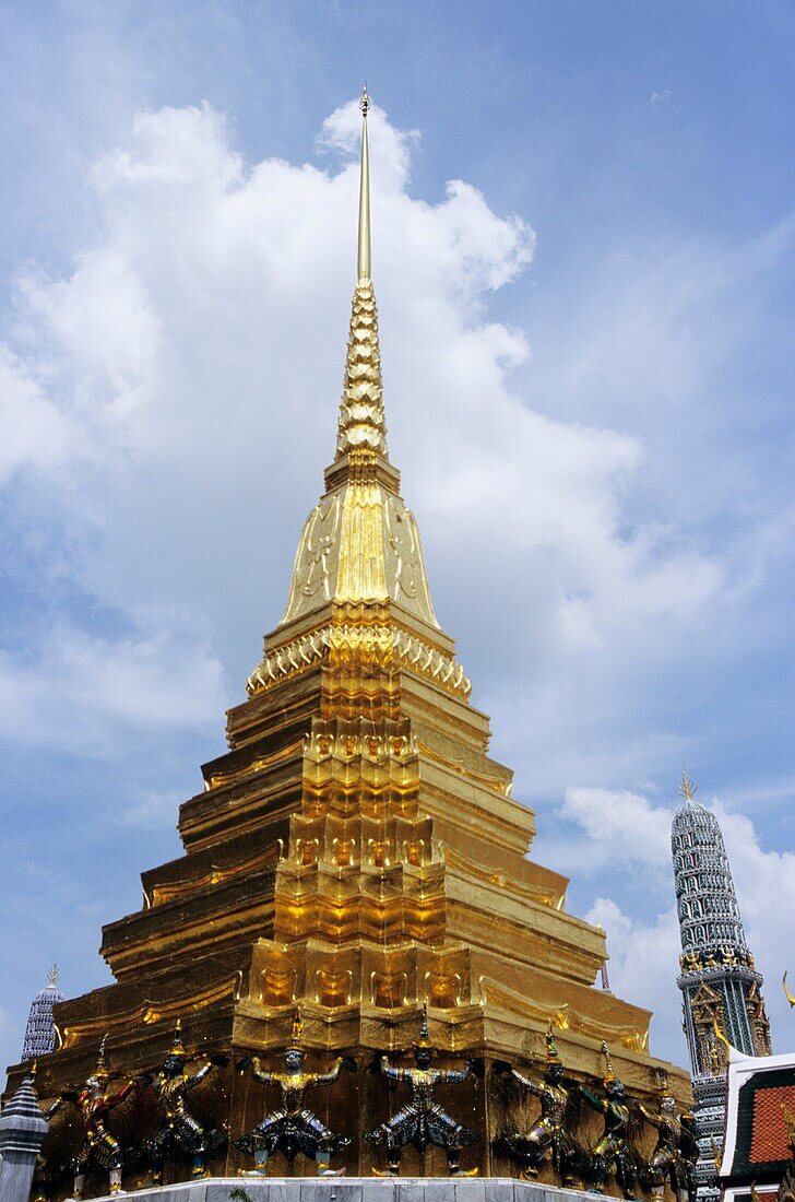 The statues of Demon Yaksha, character from the Ramakien epic at golden chedi, Wat Phra Kaeo palace, Bangkok, Thailand