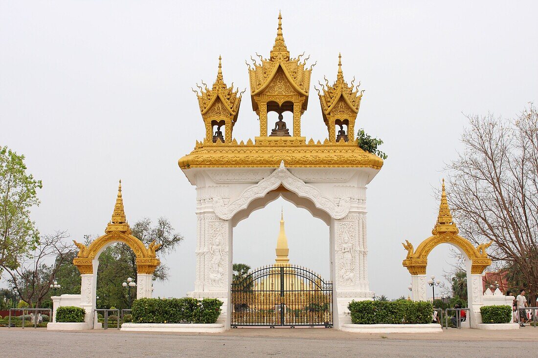 Ancient, Architecture, Art, Asia, Buddhism, Building, Color, Colour, Day, Daylight, Daytime, Gate, Gateway, Golden, Holy, Horizontal, Lao, Laos, Monument, National, Outdoor, Pha That Luang, Religion, Stupa, Symbol, Temple, Tourism, Touristic, Travel, Vien