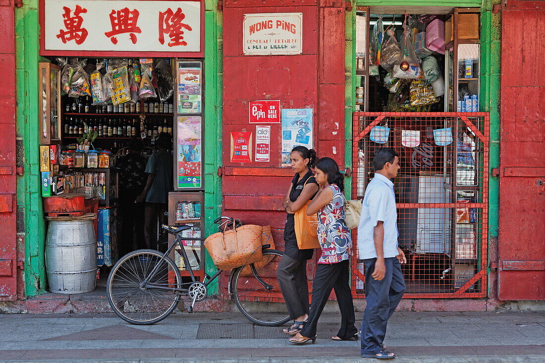 Street scene, people in front of a shop at rue de la Reine, Port Louis, Mauritius, Africa