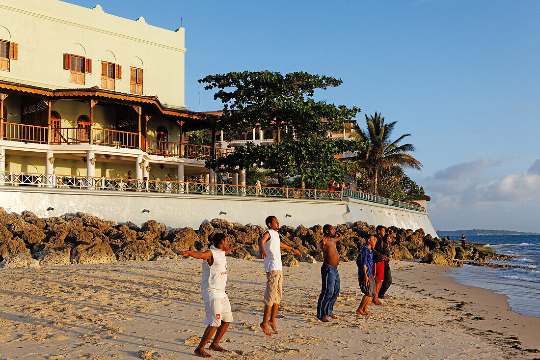 Children doing beach gymnastics in front of the Serena Inn hotel, Stonetown, Zanzibar City, Zanzibar, Tanzania, Africa
