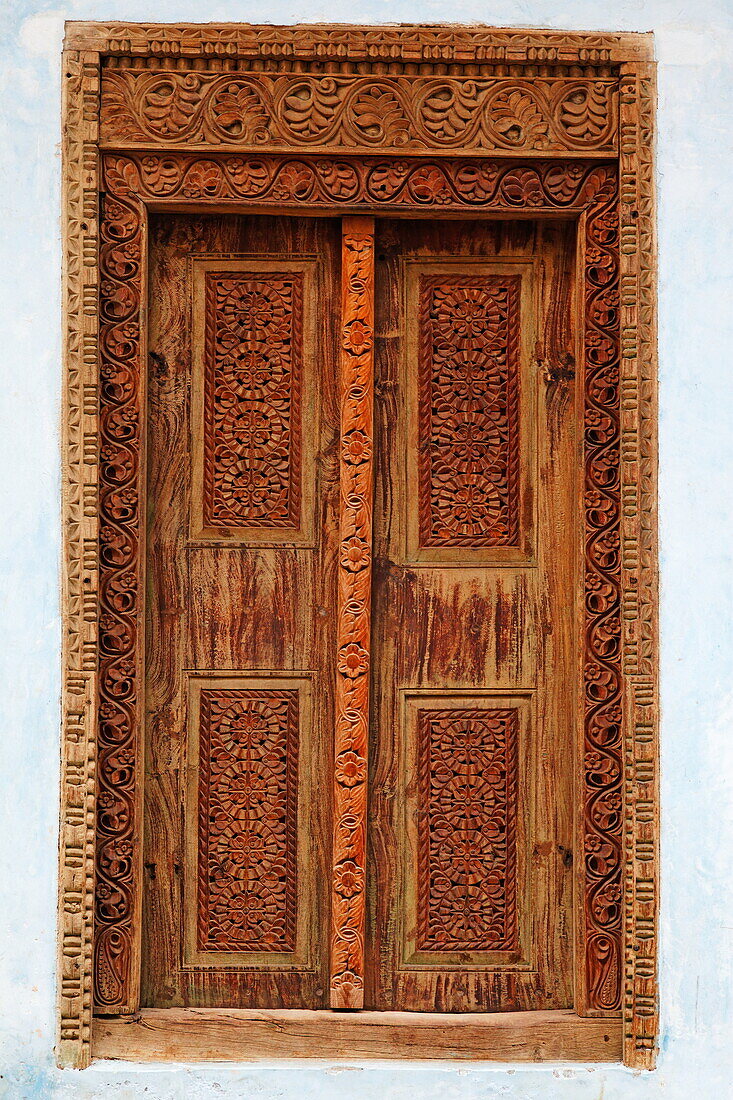 Decorated wooden door in a house in Stone Town, Stone Town, Zanzibar City