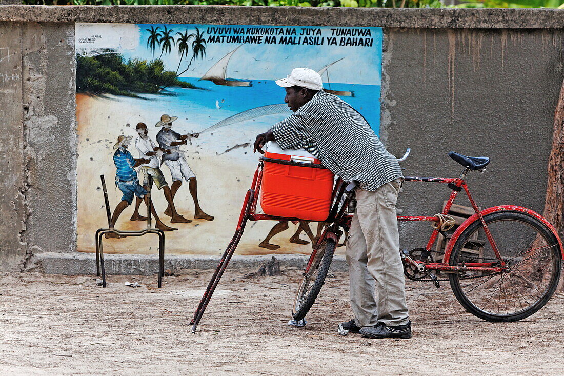 Man in front of the school gate in Jambiani, Zanzibar, Tanzania, Africa