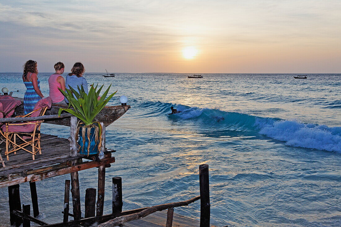 People on the terrace of the Z Hotel at sunset, Nungwi, Zanzibar, Tanzania, Africa