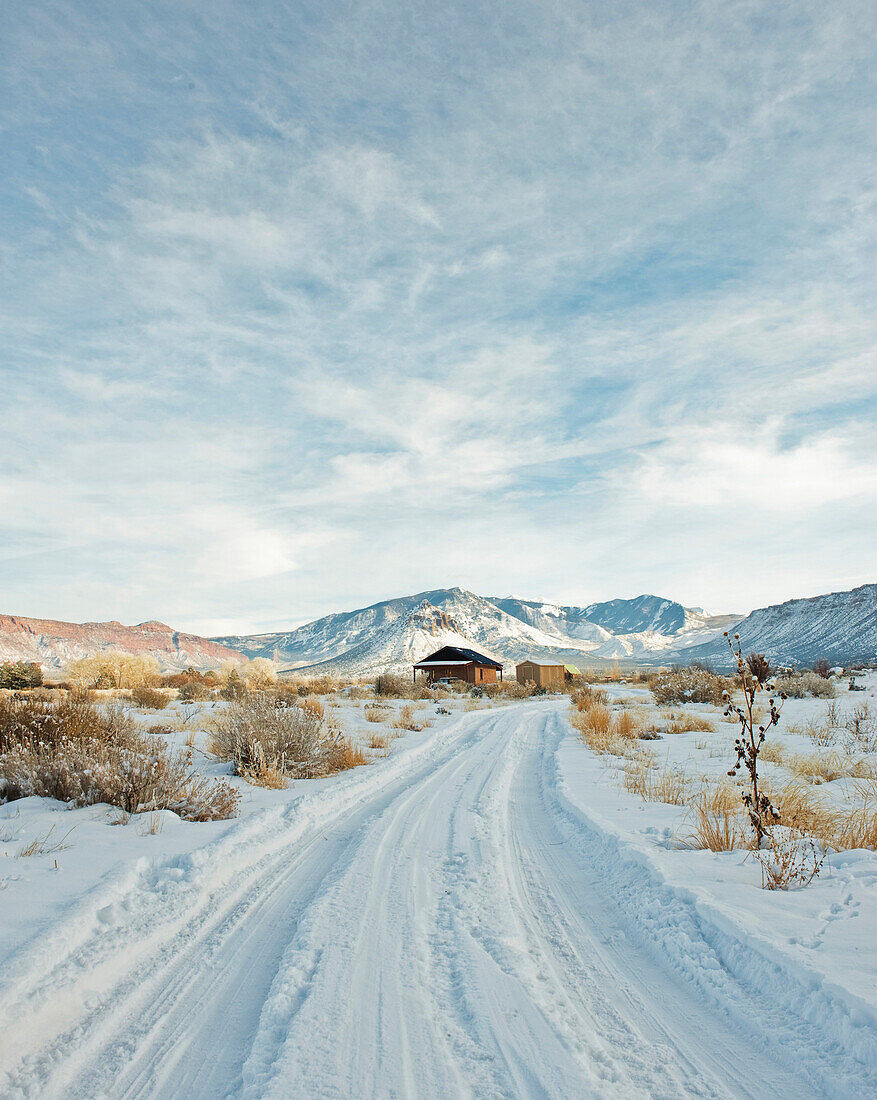 Snowy Trail Leading to a Remote House, Moab, Utah, USA