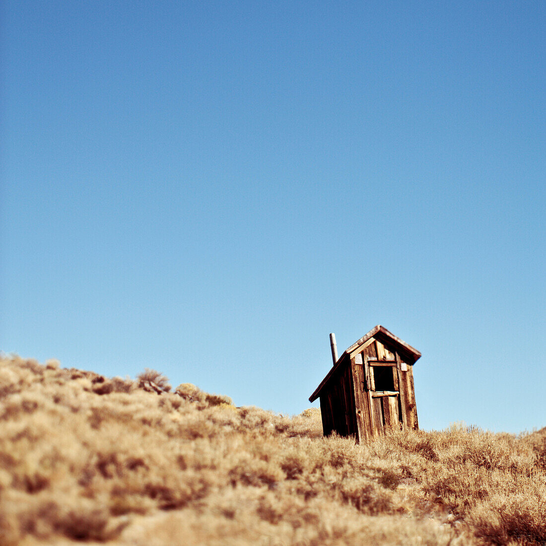 Dilapidated Outhouse on Hillside, Bodie, California, USA