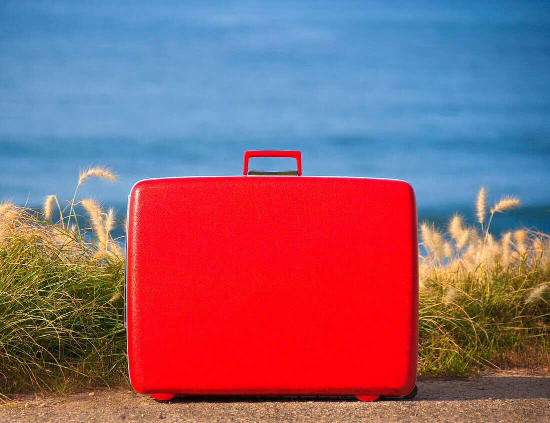 Red Suitcase on Beach, CA, USA