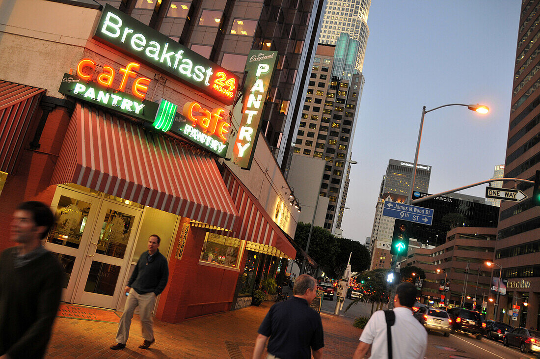 People outside illuminated Cafe Pantry in the evening, Downtown, Los Angeles, California, USA, America