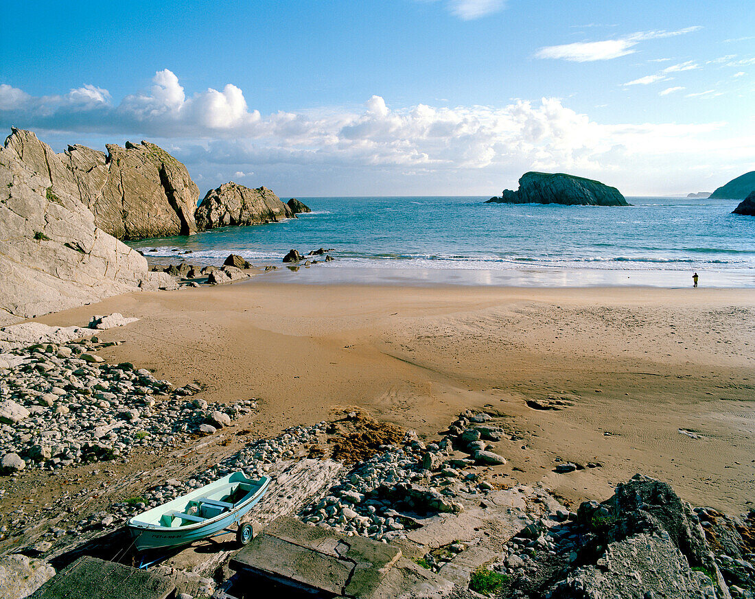 Fishing boat on the beach at Playa de Arnia in the morning, west of Santander, Cantabria, Spain