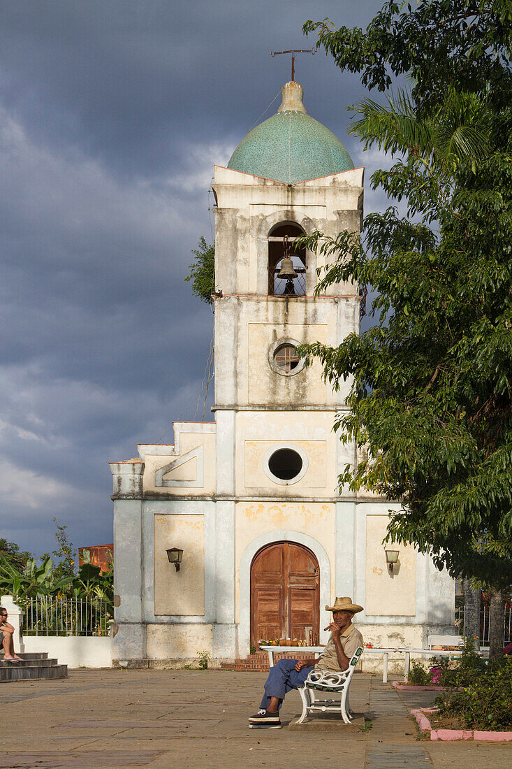 Old Man with cigar in front of village church, Vinales Valley, Province Pinar del Rio, Cuba, Greater Antilles, Antilles, Carribean, West Indies, Central America, North America, America