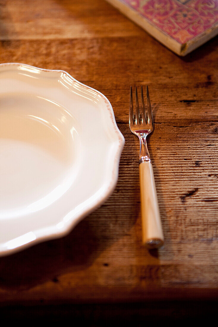 Plate and a fork on a table, Tyrol, Austria