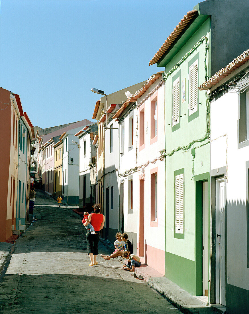 Fischermen's houses along small street in coastal town Rabo de Peixe, Sao Miguel island, Azores, Portugal