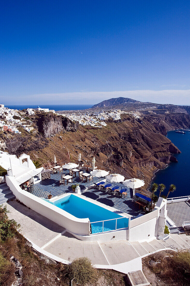 Clifftop swimming pool and view to Fira, Imerovigli, Santorini Island, Greek Islands