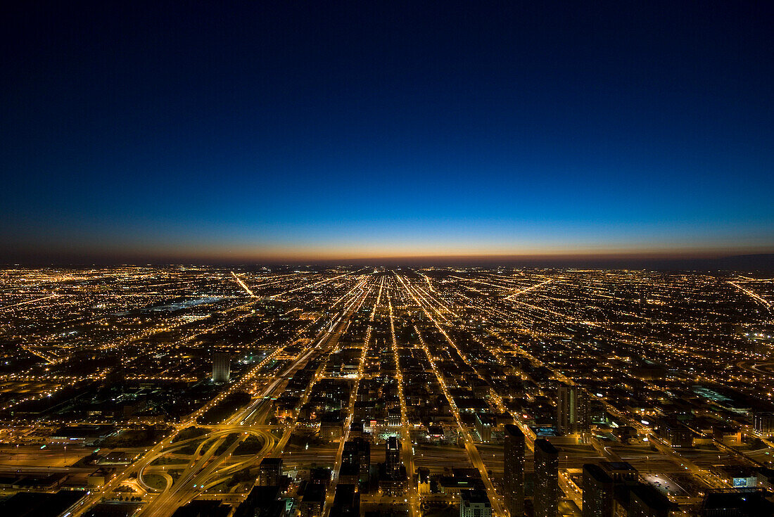 View over city looking west at dusk, Chicago, Illinois, USA