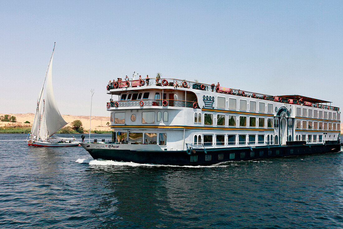 Felucca and cruise boat on River Nile, Aswan, Egypt