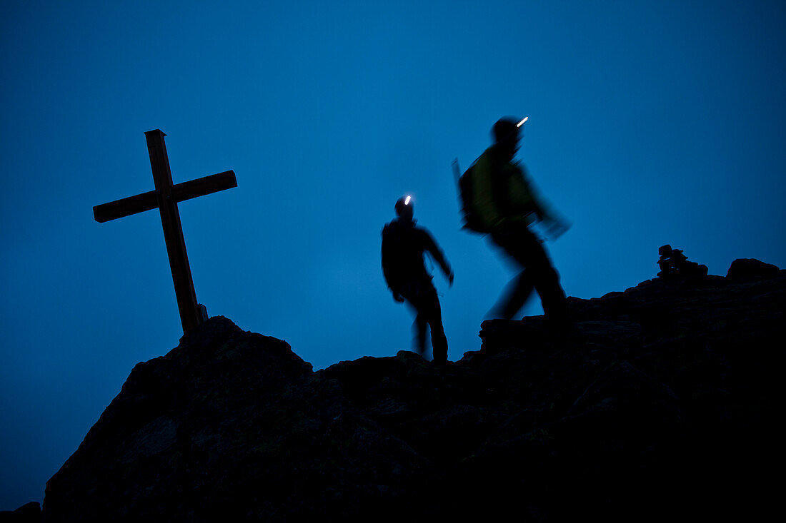 Mountaineers with headlamps at southeast ridge of Wildspitze, Oetztal Alps, Tyrol, Austria