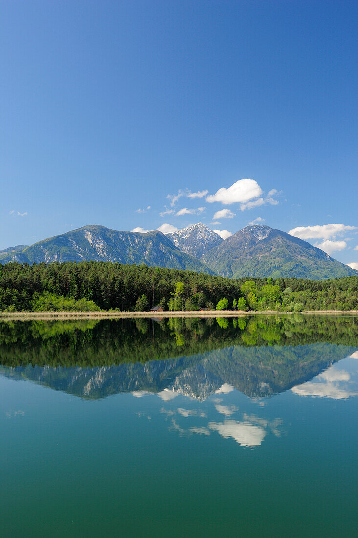 Karawanken range reflecting in lake Turnersee, lake Turnersee, Carinthia, Austria, Europe