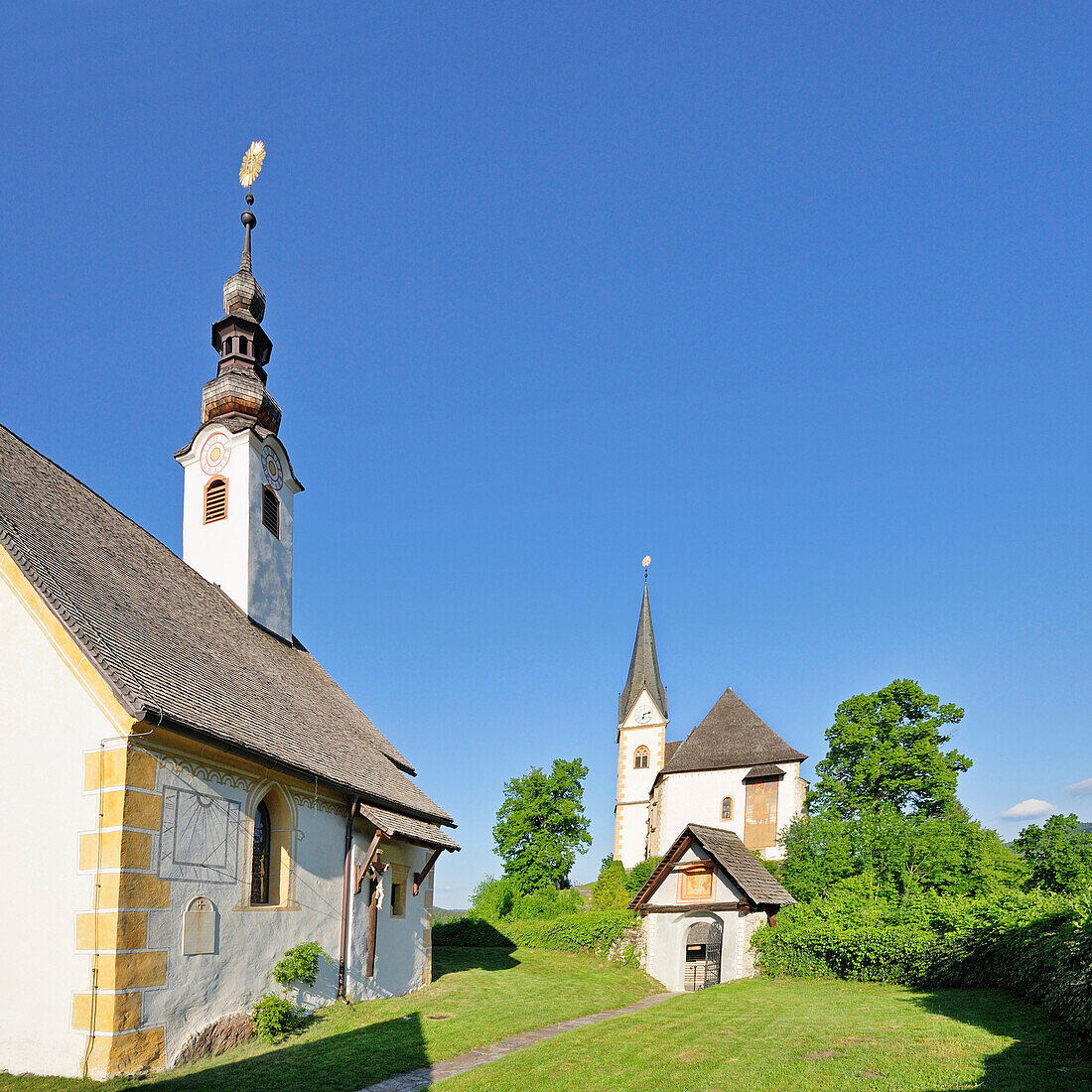 Churches of Maria Woerth under blue sky, Carinthia, Austria, Europe